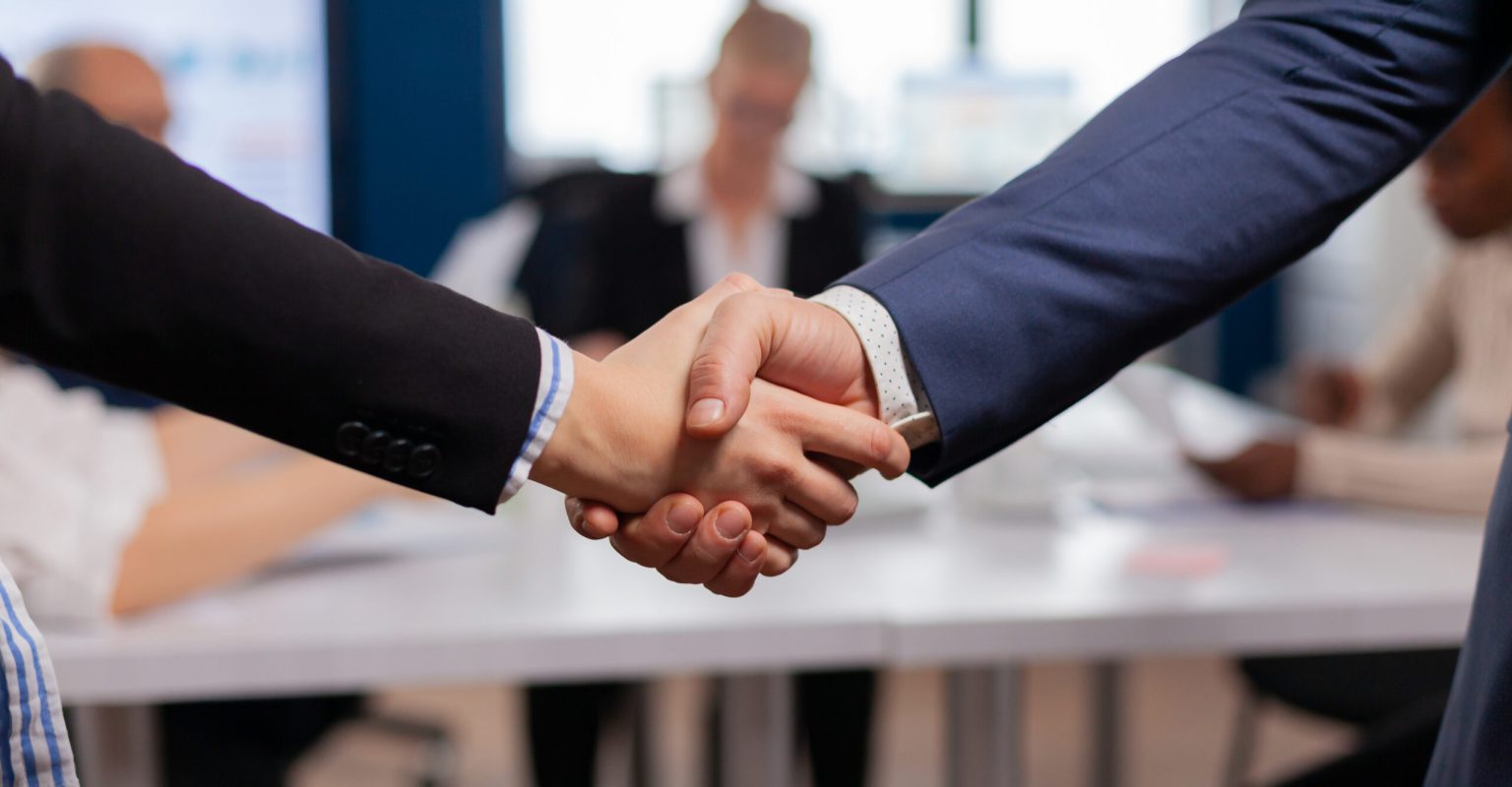 Satisfied businessman company employer wearing suit handshake new employee get hired at job interview, Man hr manager employ successful candidate shake hand at business meeting, placement concept